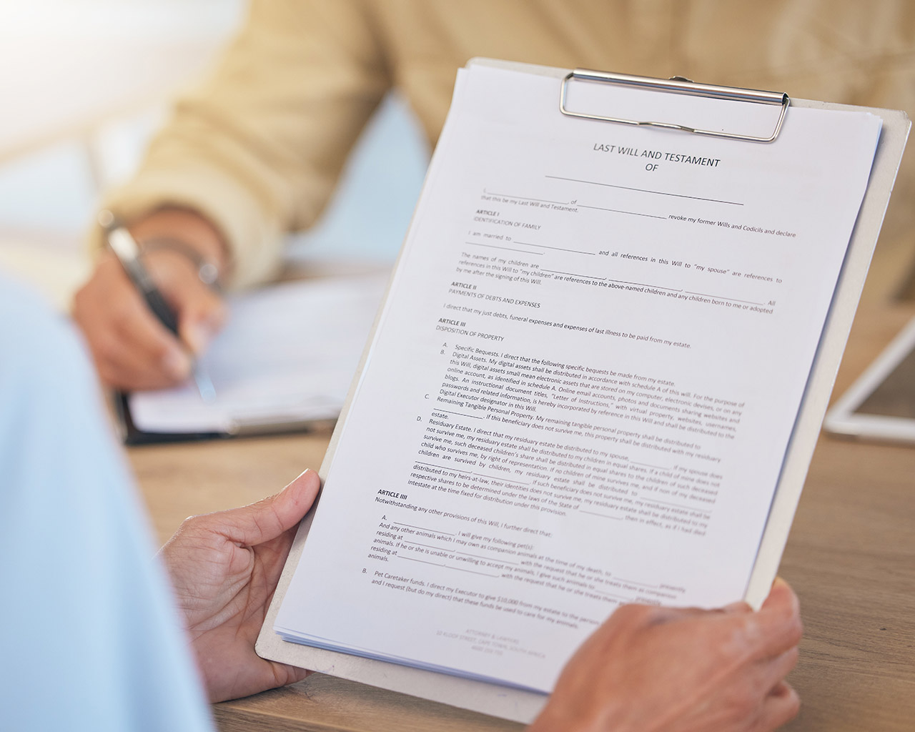 Person reviewing insurance forms and benefit documentation.